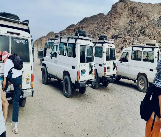 Jeep safari vehicles ready beside the Eastern Desert mountains