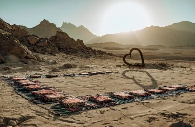 Sunset over a quiet desert camp setting