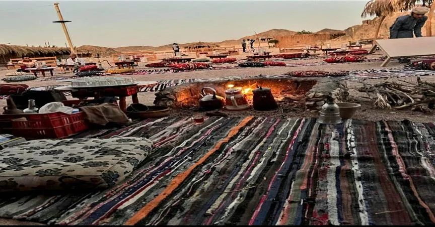 Traditional desert seating with tea beside the fire