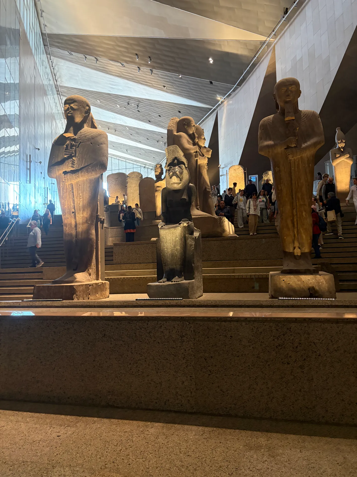 Ancient Egyptian statues displayed in the Grand Egyptian Museum