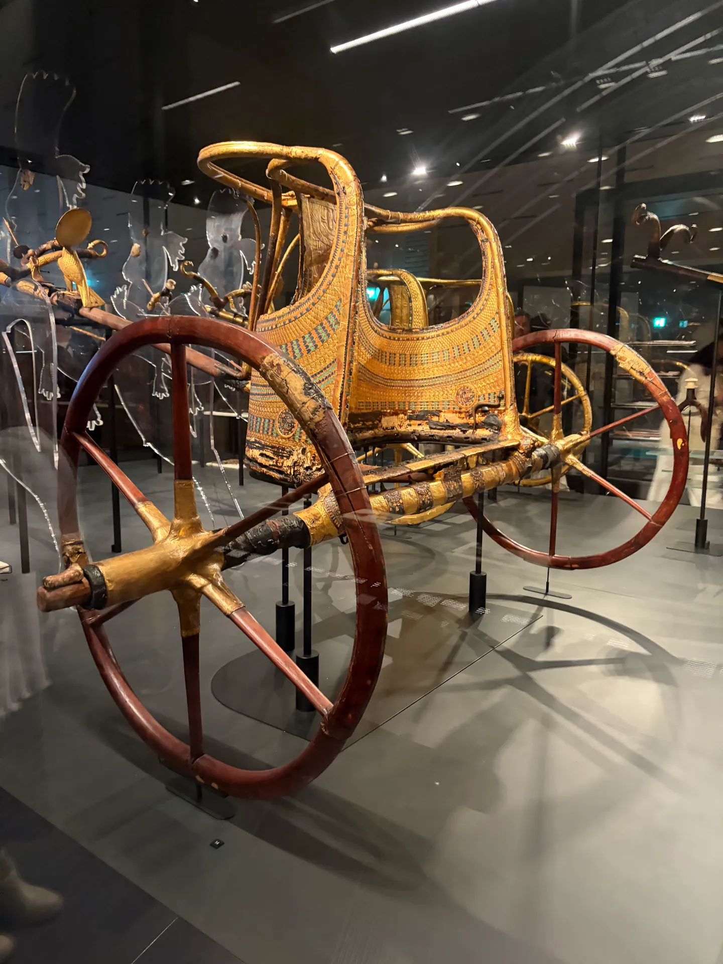 Restored ancient Egyptian chariot in the museum gallery
