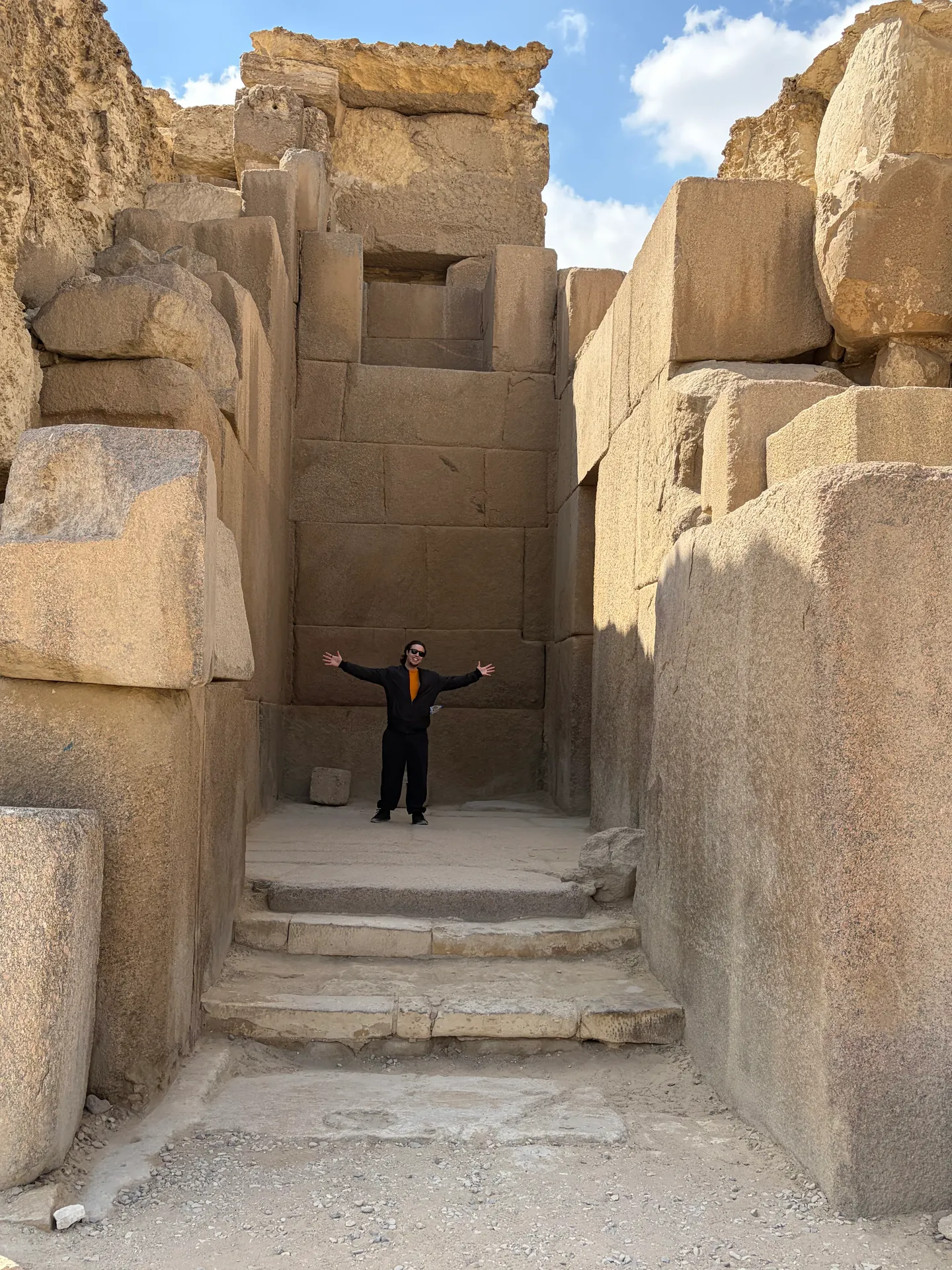 Visitor inside an ancient stone temple at Giza