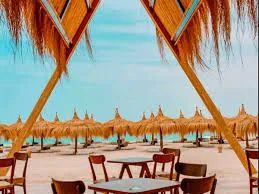 Eden Island beach framed by a shaded wooden structure