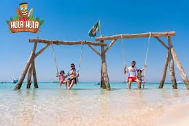 Hula Hula Beach swings in shallow turquoise water