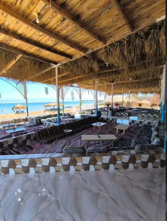 Shaded open-air lounge at the Nuweiba beach camp