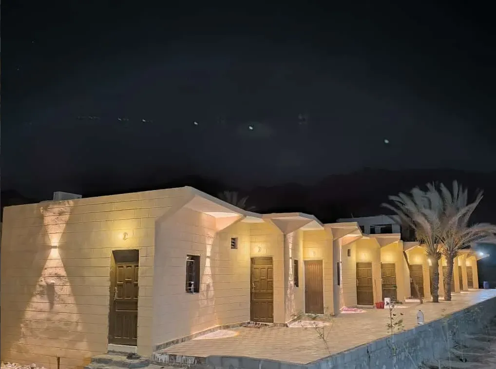White guest building illuminated at the Nuweiba camp