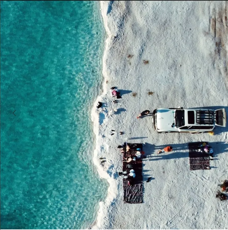 Aerial view of a vehicle beside the Siwa salt lakes