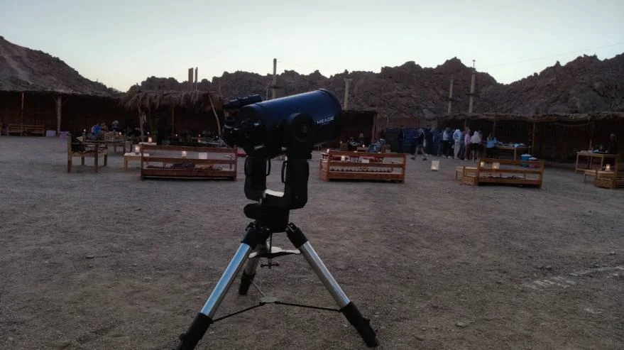Telescope prepared for stargazing in the desert camp