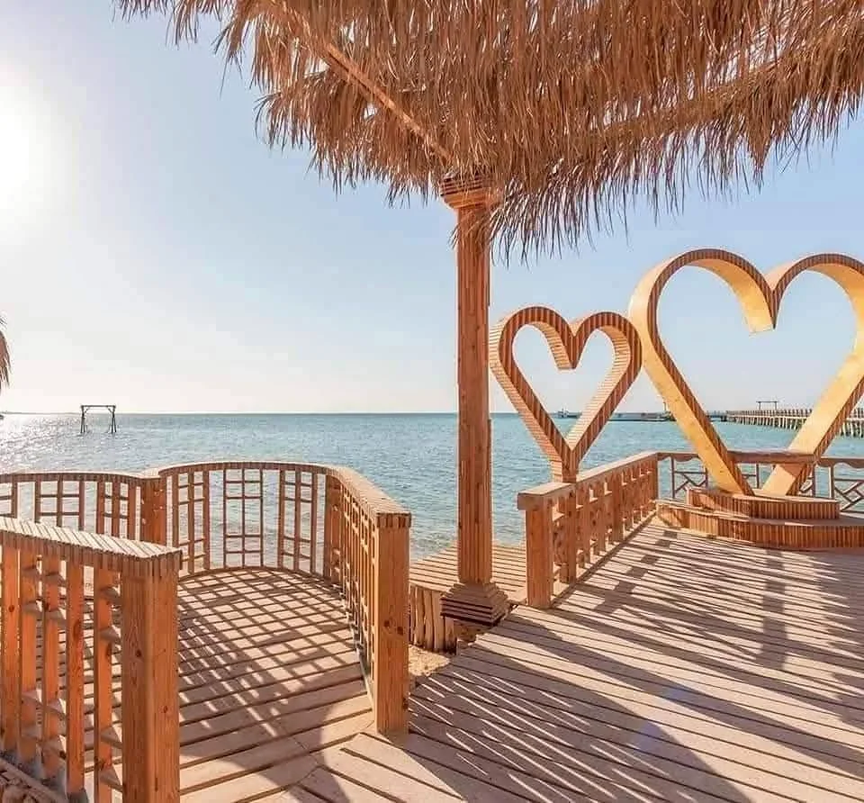 Wooden deck with heart photo frames over the Red Sea at Orange Bay